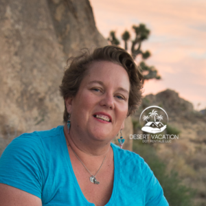 profile image of a woman with a large boulder and a joshua tree in the desert background