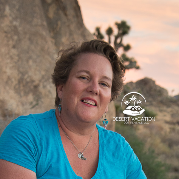 Profile Image of a Woman with a Large Boulder and a Joshua Tree in the Desert Background